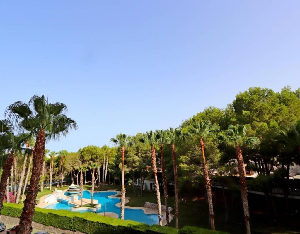 Apartment In Campoamor Overlooking The Swimming Pool Exterior photo